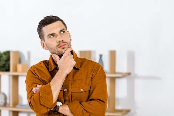 image of a homeowner thinking about a heating system tune-up