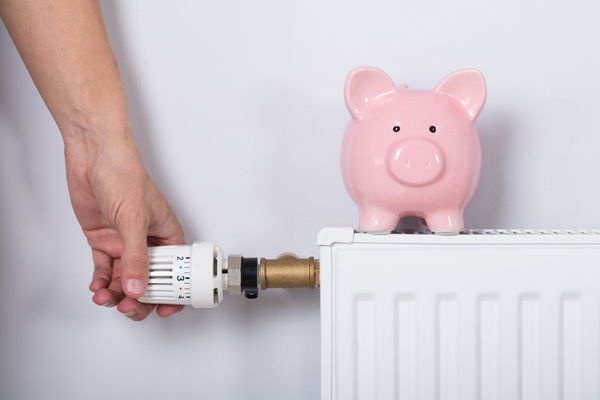 image of radiator with money and home heating costs