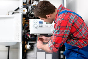 image of an hvac contractor performing a boiler repair